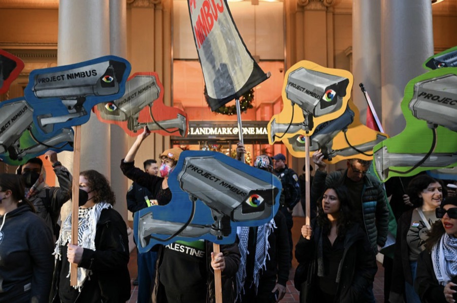 Protesters at a demonstration holding signs opposing Project Nimbus