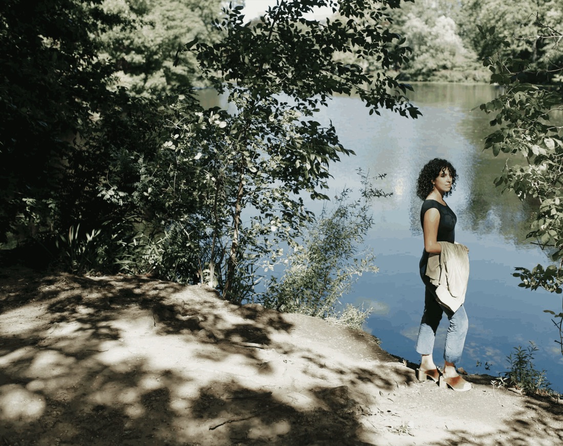 A former Cisco employee standing by a lake, photographed for the New York Times story